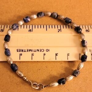 Silver tone and dark blue beaded bracelet